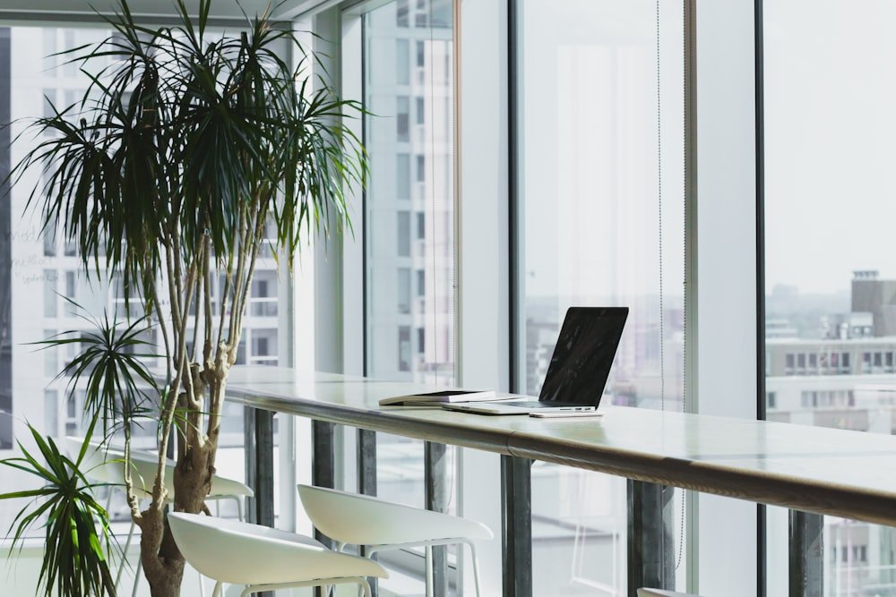 Bright, uncluttered workspace with a computer beside a window